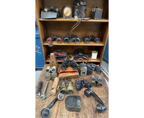 A collection of binoculars, opera glasses, a metronome etc in one box