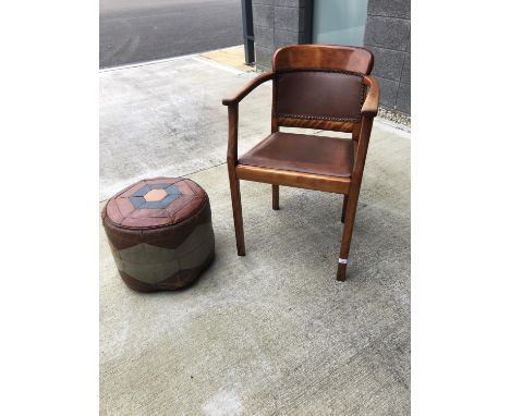 Tub armchair with leather back and seat, and a vintage leather poufe.