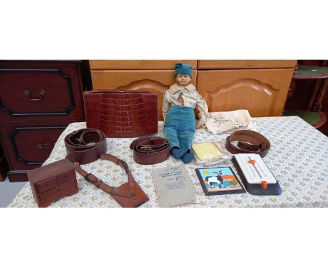 A crocodile skin handbag, a doll with a ceramic head, a gunsliner leather belt and other leather belts, a miniature chest of 