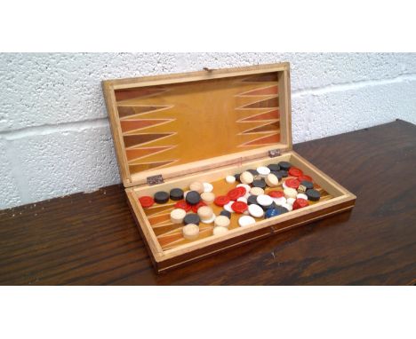 Box of vintage brass darts and a set of backgammon.