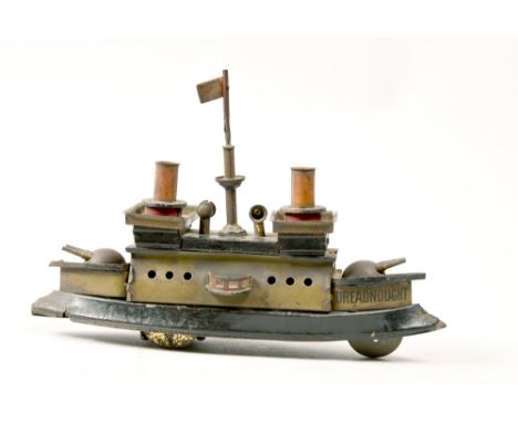 An early 20c Hess clockwork tin plate model Dreadnought, 8in w.