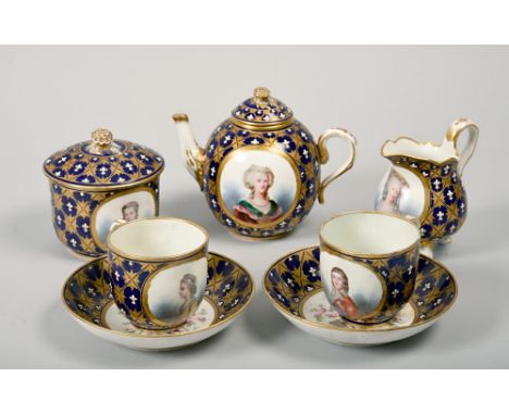 A late 18c Sevres part teaset of Gros Bleu ground with gilt pattern and fleur de lys in white relief enamel and consisting of