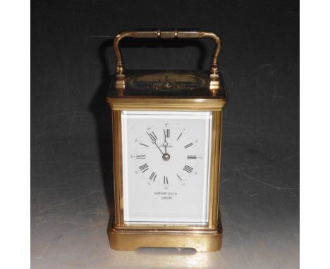 A late 20c striking carriage clock retailed by Garrard &amp; Co, the movement by Epee and having a rectangular white dial wit