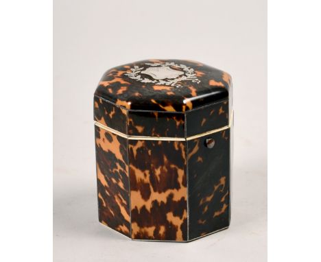 An early 19c tortoiseshell tea caddy of cylindrical octagonal form with a hinged dome cover, with shield and wreath motif, 3.