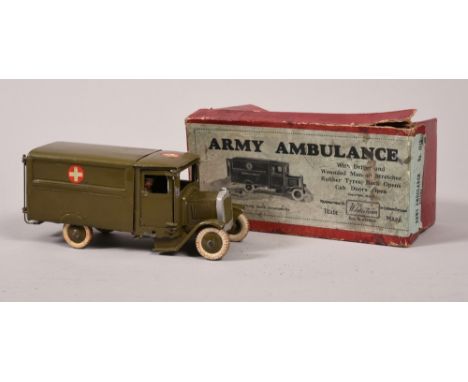 A boxed Britains army ambulance with driver and wounded man, in red box.