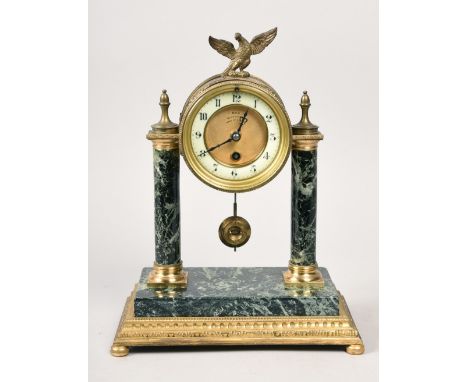 A late 19c French mantel clock, the brass drum of the movement supported on two variegated marble columns with gilt capitals 