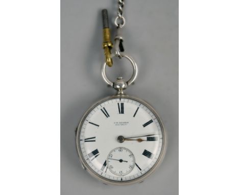 An English lever pocket watch by J.W. Bensor of London with plain balance and internal dust cover.  The white enamel dial has