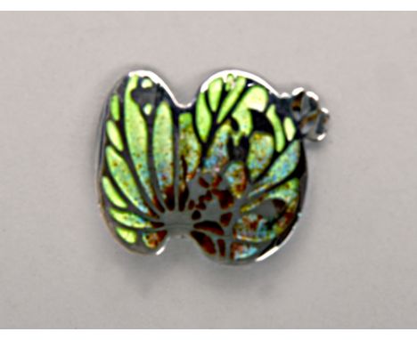 A silver and enamel Art Nouveau style brooch, designed by Norman Grant, Edinburgh.