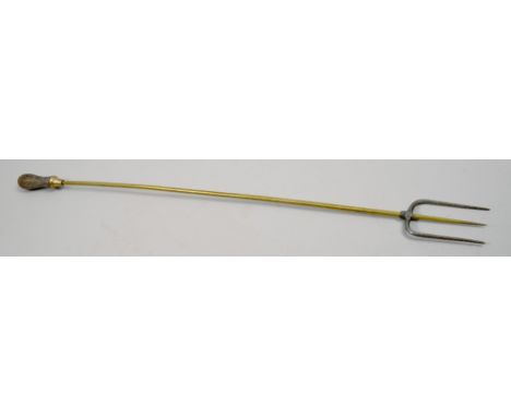 A late Georgian brass and steel long handled toasting fork, 26in l.