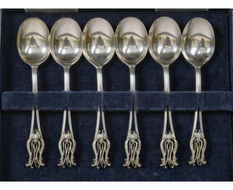 A boxed set of six Australian silver coffee spoons with opal set pierced feathered terminals, sterling with Australian makers