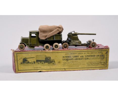 A Britains ten wheel lorry  with two pounder and light anti aircraft gun in red box.
