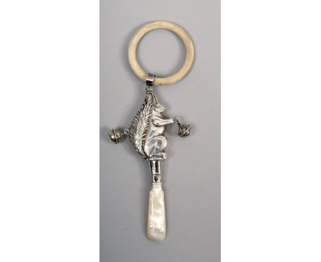 A childs silver rattle in the form of a squirrel with mother of pearl chew and a ring, makers mark for Crisford &amp; Norris 