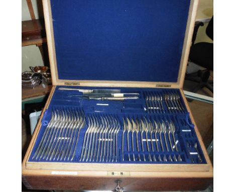 A Garrard &amp; Co Ltd part canteen of silver cutlery comprising twelve table spoons, a soup ladle, a fish carving knife and 