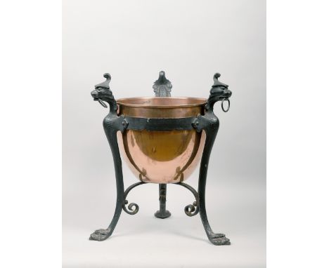 A Victorian jardiniere stand with an ovoid copper bowl supported in a cast iron formed tripartite frame with mythical beast r