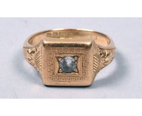 An 18c gold signet ring engraved and set with a solitaire diamond.