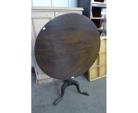 A George III mahogany circular tilt top tripod table