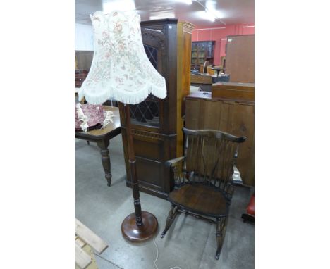A beech rocking chair and a standard lamp