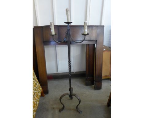 A French wrought iron standard lamp