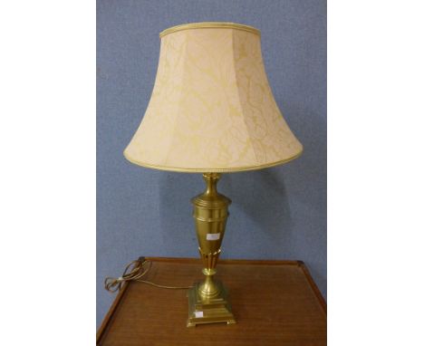 A brass urn shaped table lamp