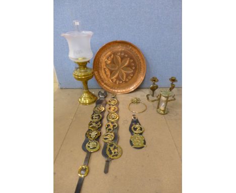A copper charger, brass oil lamp, egg timer, etc.