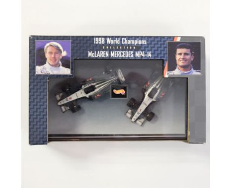 Hot Wheels 24526 - McLaren MP4-14 1998 World Champions Mika Hakkinen and David Coulthard - 1/64 - Stock Code - N/A Scale - 1: