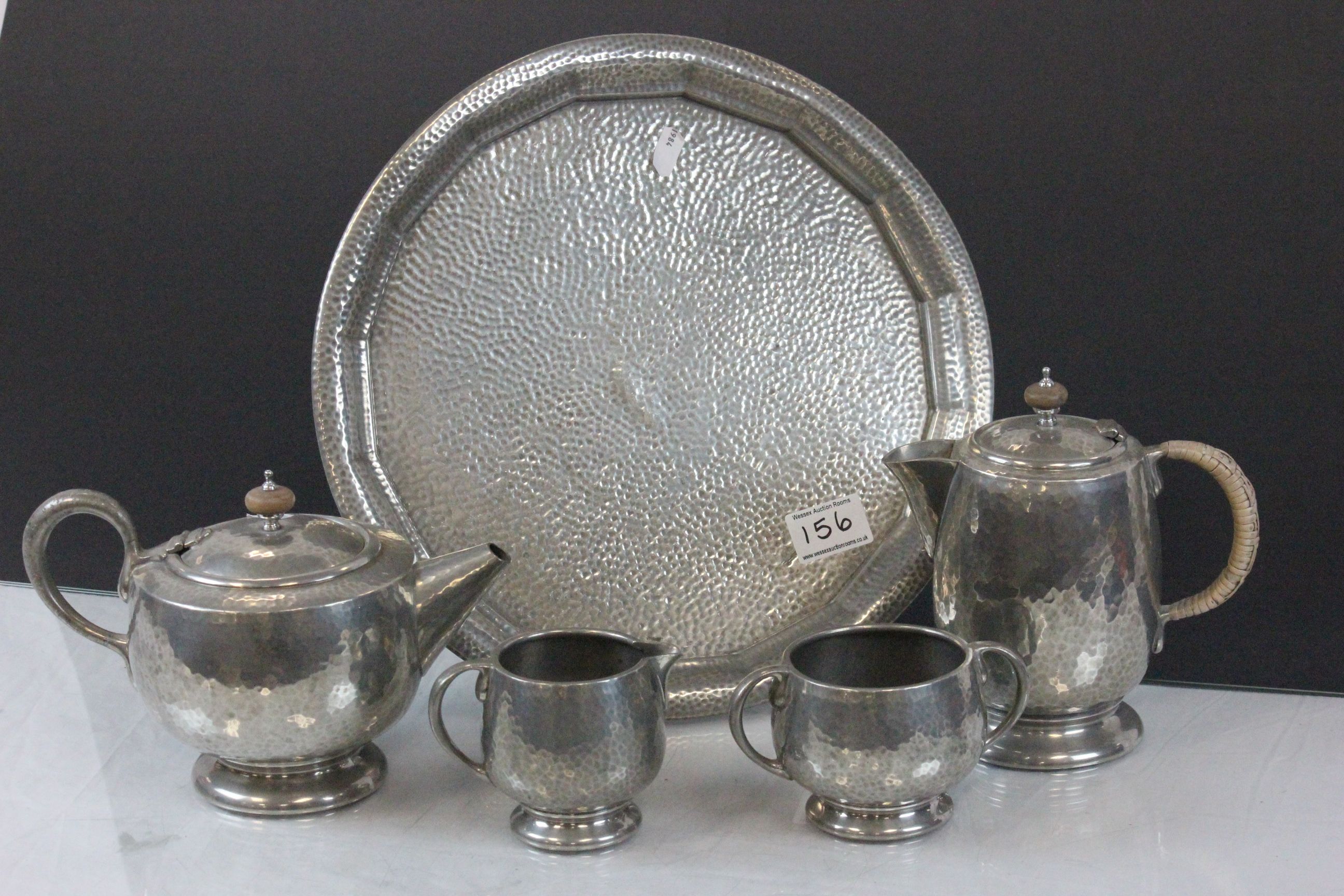 Four piece Tudric hammered pewter tea set with a similar hammered