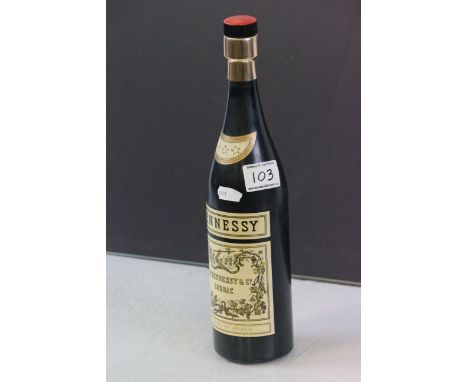 Musical cigarette dispenser in the form of a Hennessy Cognac bottle