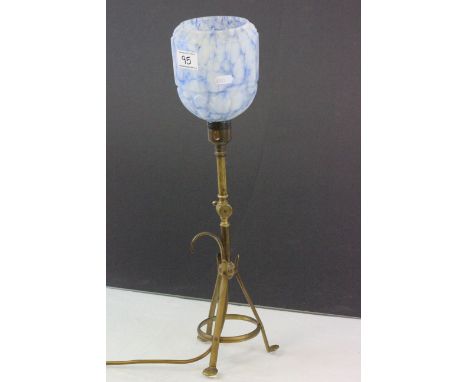 An antique gimble arts and crafts lamp with glass shade.