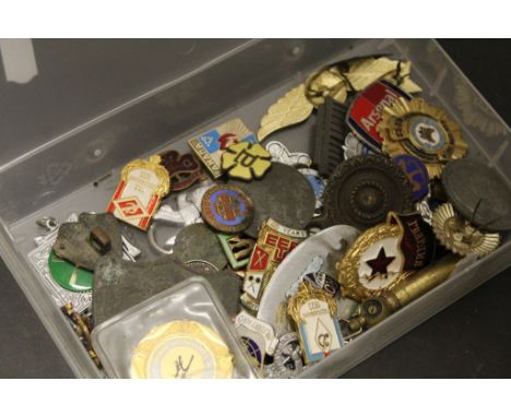 Collection of vintage badges including military examples