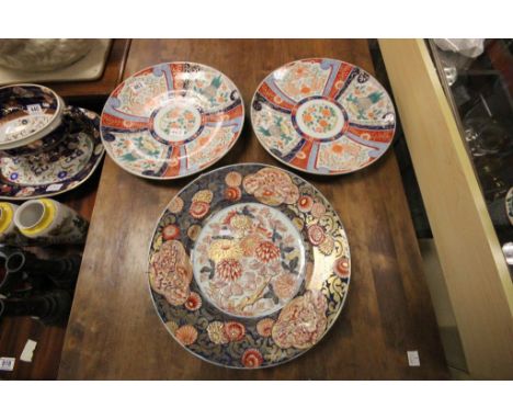 Three vintage Oriental chargers, one with gilt detailed Flowers and Dogs of Foe