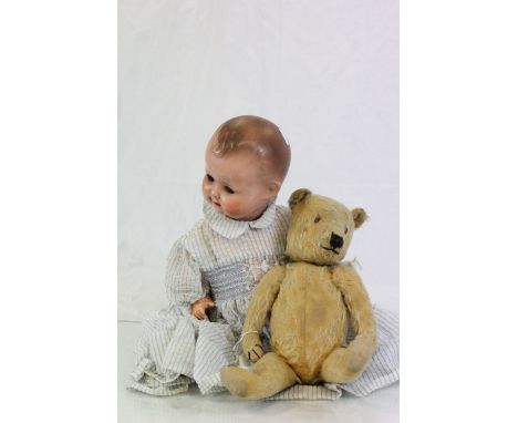 August Steiner bisque headed doll and a vintage Teddy bear