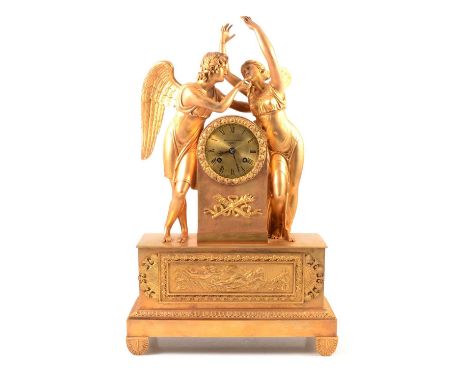 French ormolu mantel clock, the case designed with Apollo crowned, on a classical plinth, anthemion legs, circular dial signe