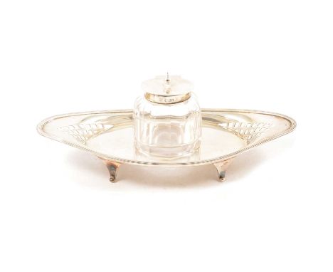 Silver ink stand, marks worn, navette-shape, with reeded outlines, pierced sides, four scrolled feet, glass well, 21cm, 3.9oz
