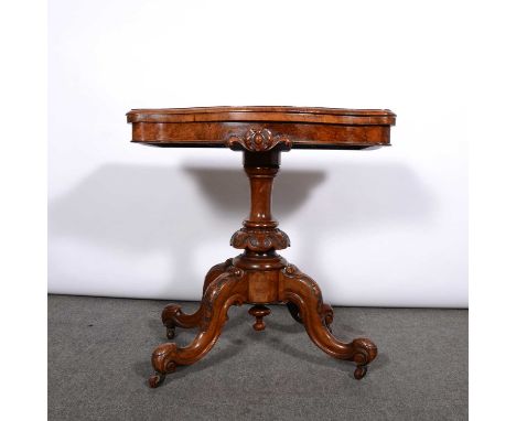 Victorian walnut and marquetry card table, serpentine foldover top enclosing a leatherette lined interior, turned and carved 