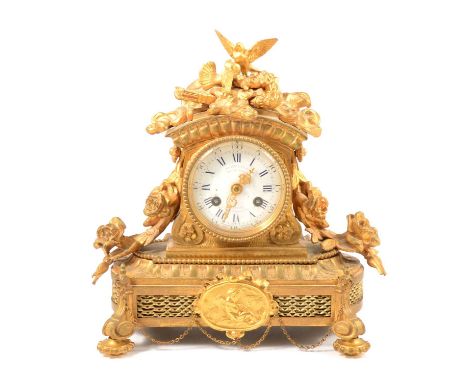 French ormolu mantel clock, the case surmounted with doves, flowers, arrows and a torch, the sides with roses, on scrolled fe