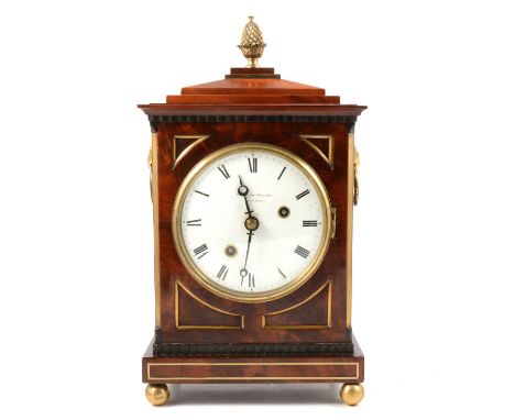 Regency mahogany mantel clock, the case with brass pineapple finial and brass stringing, ball feet, circular enamelled dial w