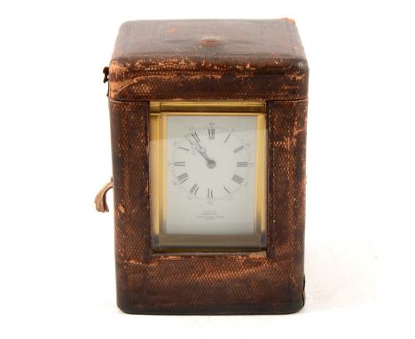 Brass carriage clock, the case with bevelled glass panels, rectangular enamelled dial, Roman numerals, inscribed "Examined by
