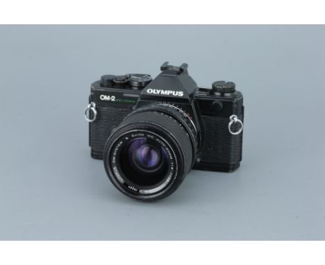 An Olympus OM-2 SLR Camerablack, serial no. 1117567, with S Zuiko MC Auto-Zoom f/4 35-70mm lens, body, F-G, shutter not teste