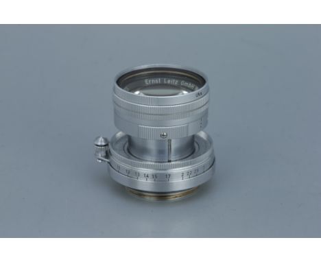 A Leitz Summicron f/2 50mm Lens,chrome, serial no. 1263290, body, VG, filter stuck, elements, G-VG, some very light haze/fung