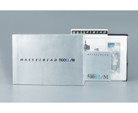 A Hasselblad 500EL/M Empty Box,with internal styrofoam blocks, one battery, charger, battery cover unlocking disc, wrist stra