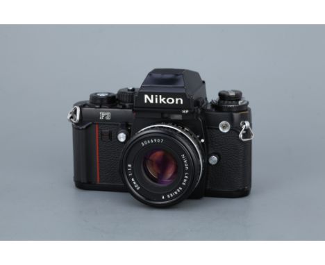 A Nikon F3 HP SLR Camerablack, serial no. 1712282, with Nikon Series E f/1.8 50mm lens, serial no. 3046907 body, G, small den