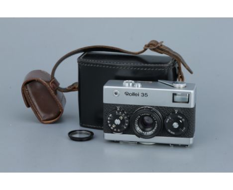 A Rollei 35 Compact Camera,chrome, with Carl Zeiss Tessar f/3.5 40mm lens, body, VG, shutter working, lens, VG, some light ma