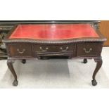 Georgian style mahogany desk on cabriole legs with ball & claw feet & a leather skiver top L130cm