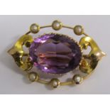 Amethyst and seed pearl brooch set in tested as 15ct gold - total weight 3.1g