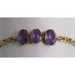 3 stone amethyst bracelet set in tested as 15ct gold - total weight 11.9g