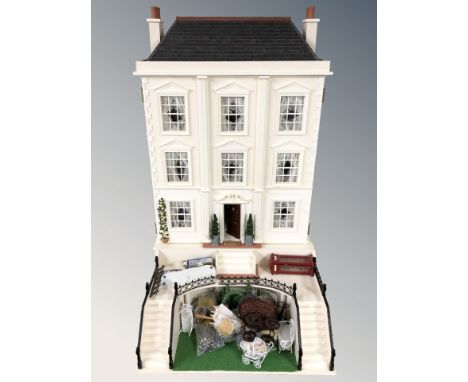 A large contemporary Georgian style doll's house, with front garden, terrace and well furnished interior including furniture,