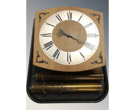 A Junghans oak wall clock with silvered dial, brass weights and pendulum.