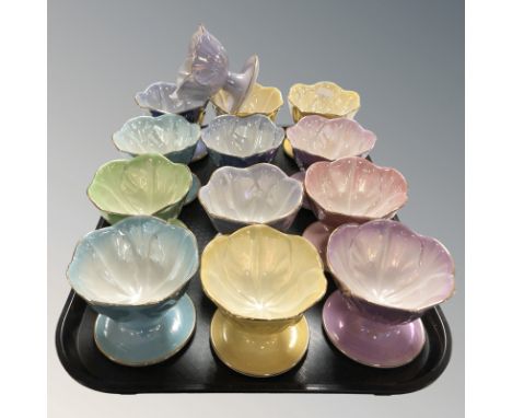 Thirteen Maling lustre grapefruit dishes in various colours.