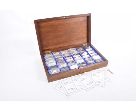 A cased set of thirty six silver ingots relating to "The Lord Montague collection of Great Cars"Each ingot weighing approxima