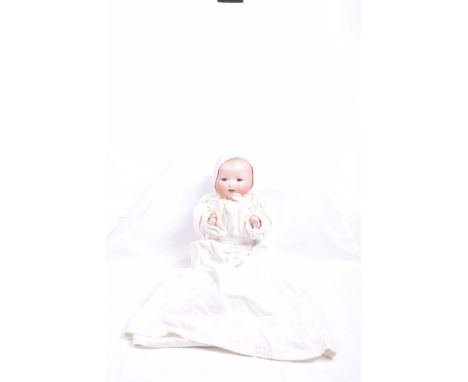 A German bisque headed My Dream Baby DollWith open/shut blue eyes, open mouth, impressed marks 'AM Germany 351/4½K' with comp